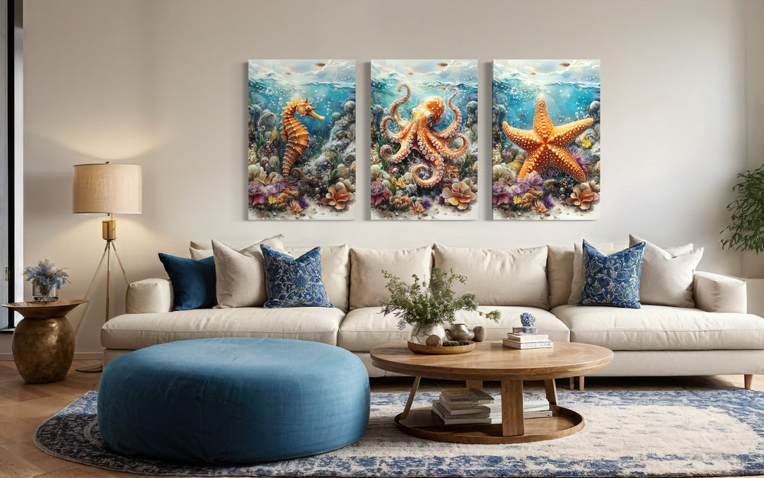 3 piece framed canvas wall art set featuring an octopus, seahorse, and starfish in a living room.