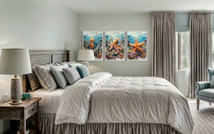 3 piece framed canvas wall art featuring a seahorse, octopus, and starfish above a bed.