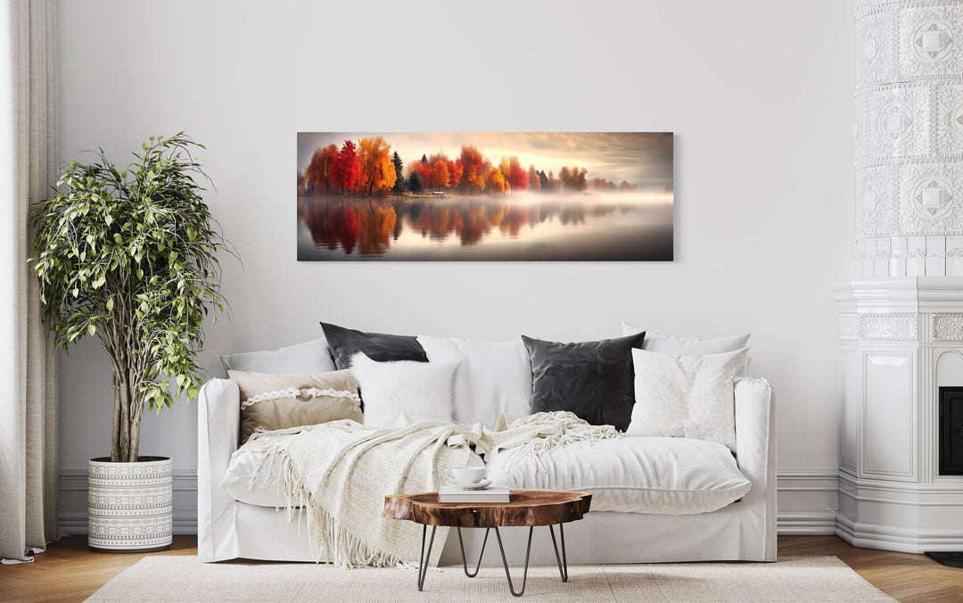 a living room with a white couch and a painting on the wall