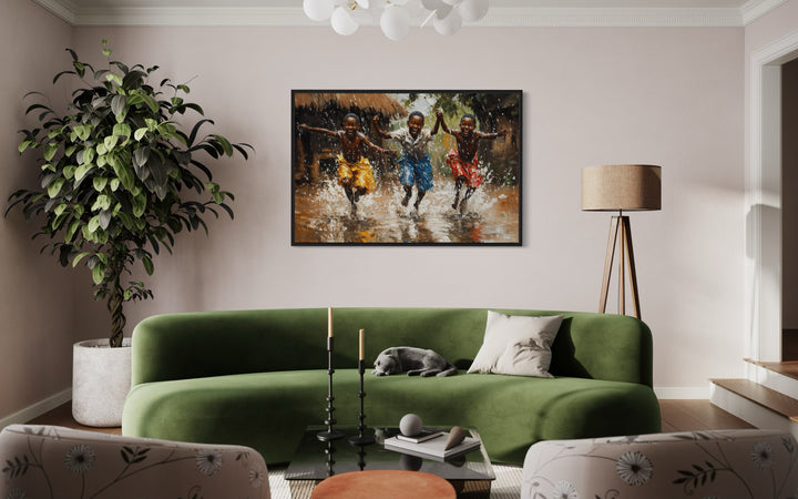 Happy African Boys Dancing In Rain Framed Canvas Wall Art in a living room filled with furniture