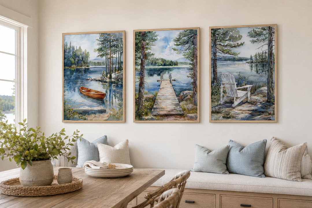Three-piece watercolor lake house wall art set with a boat, fishing dock, and Adirondack chair.