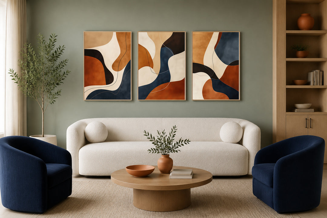 Three-piece framed abstract wall art with mid-century modern shapes in brown, cream, and navy blue.