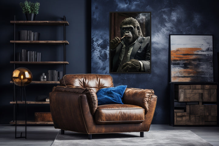 Gangster Gorilla Smoking Cigar Framed Canvas Wall Art For Men in a living room with a chair