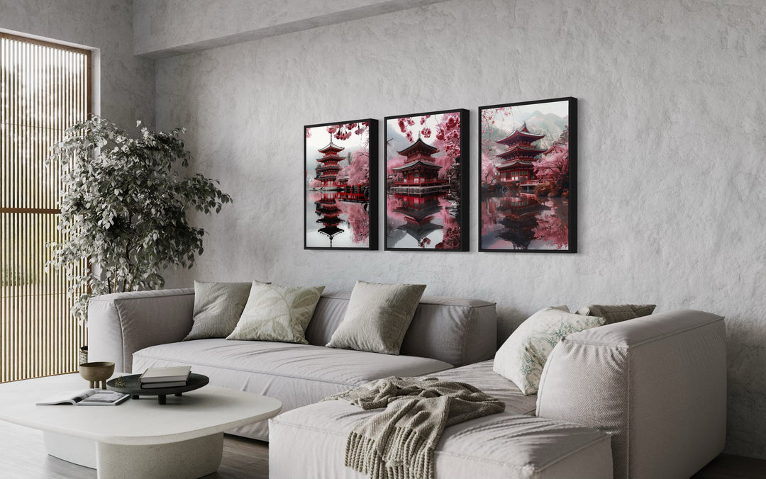 Set Of Three Japanese Pagoda and Cherry Blossom Wall Art above grey couch