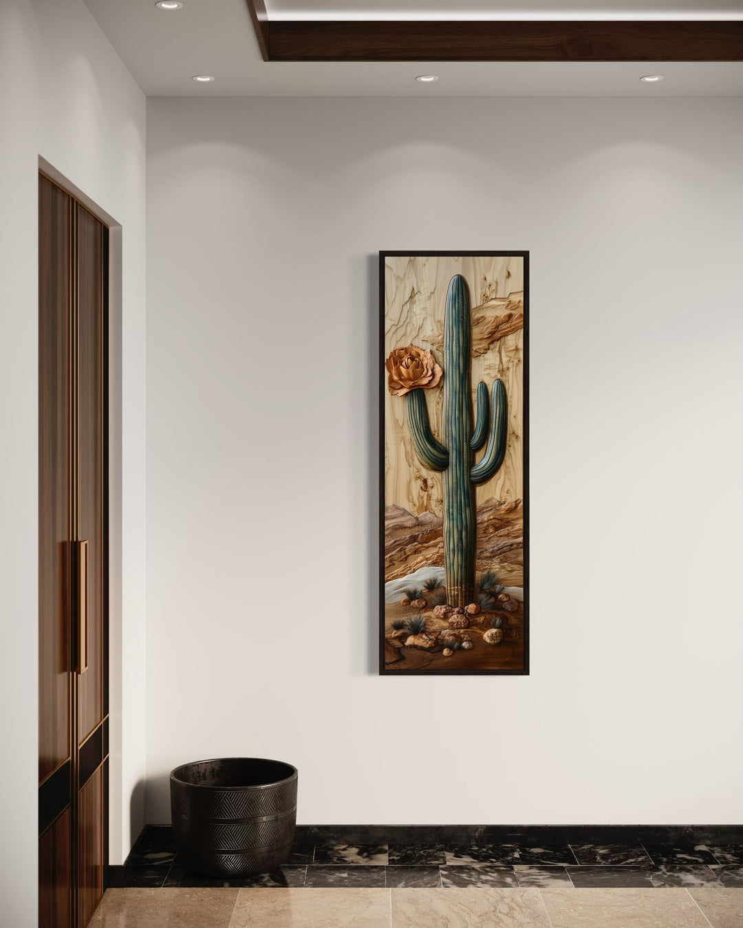 a painting of a cactus hanging on a wall