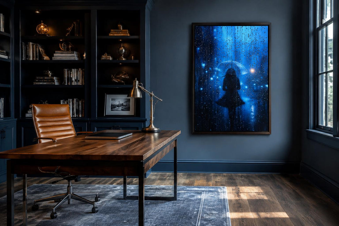 Woman silhouette walking in rain with umbrella canvas wall art in a dark blue home office.