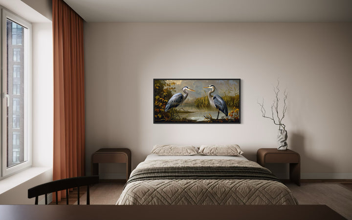 Two Blue Herons On The Lake Framed Canvas Wall Art above bed