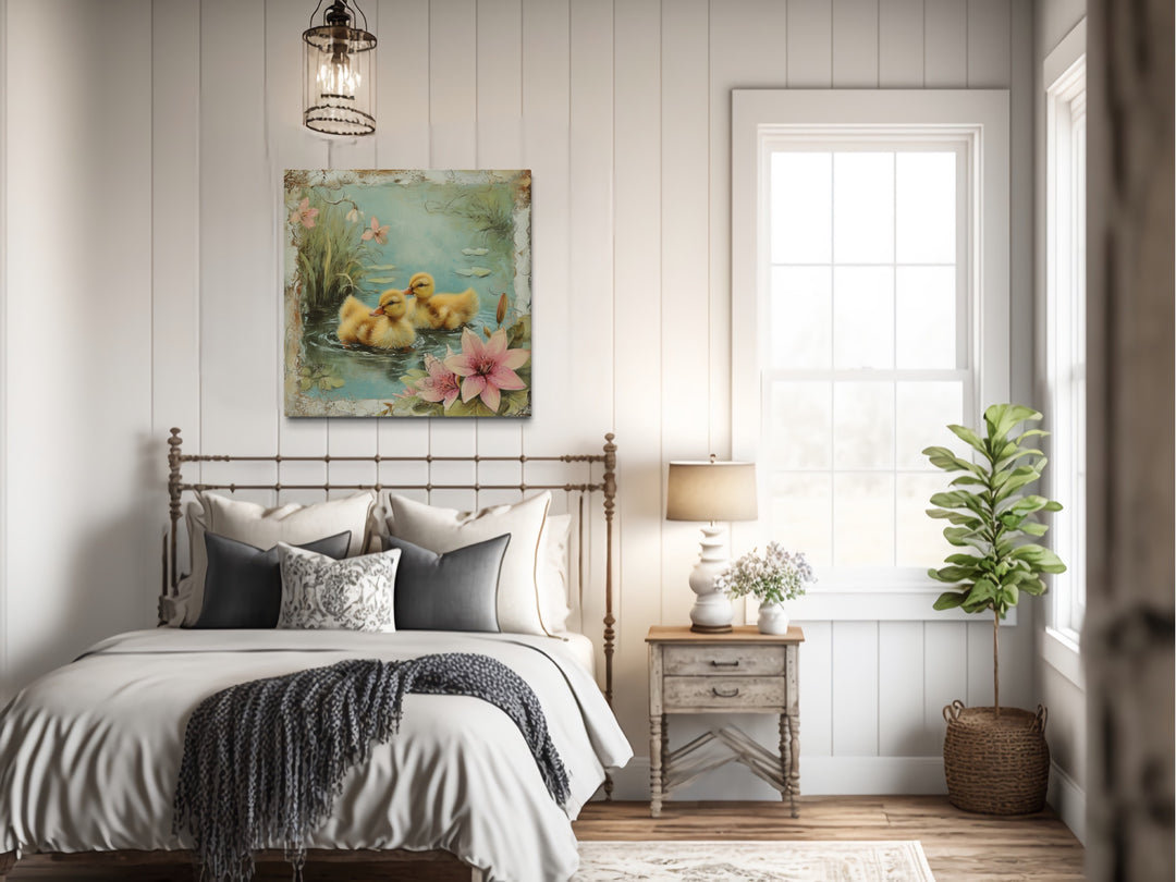 a bed room with a neatly made bed and a painting on the wall