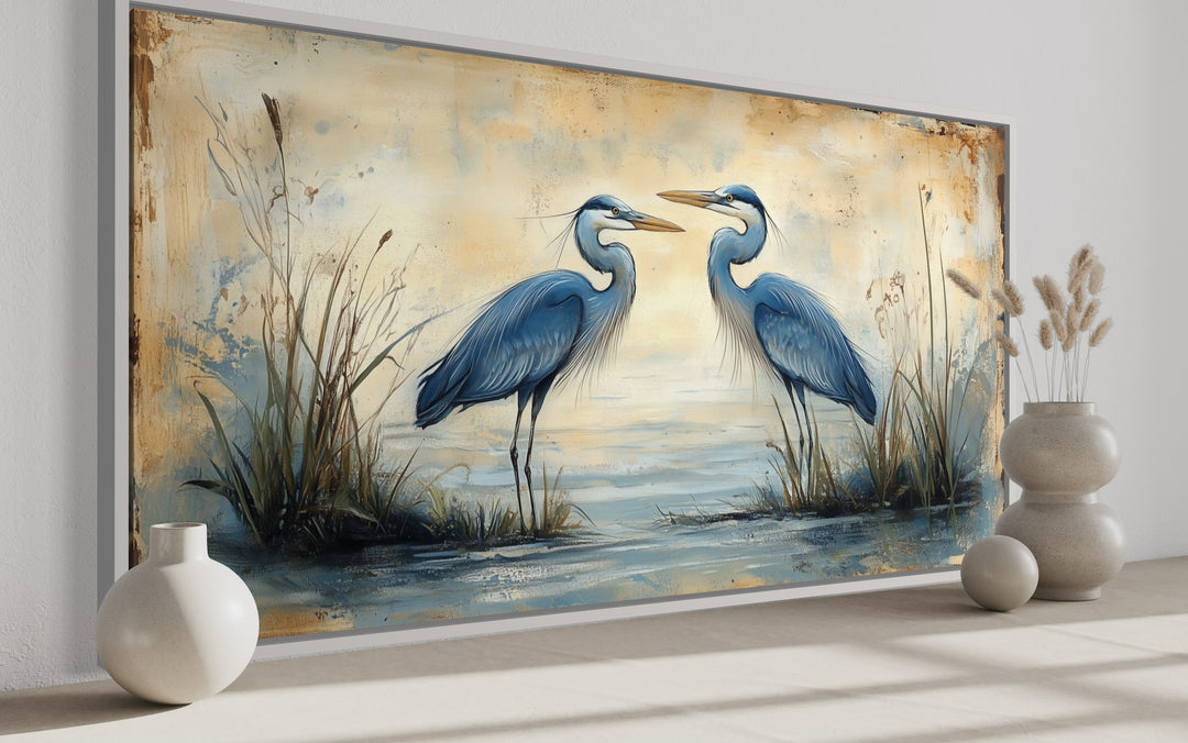 a painting of two blue herons in a marsh side view