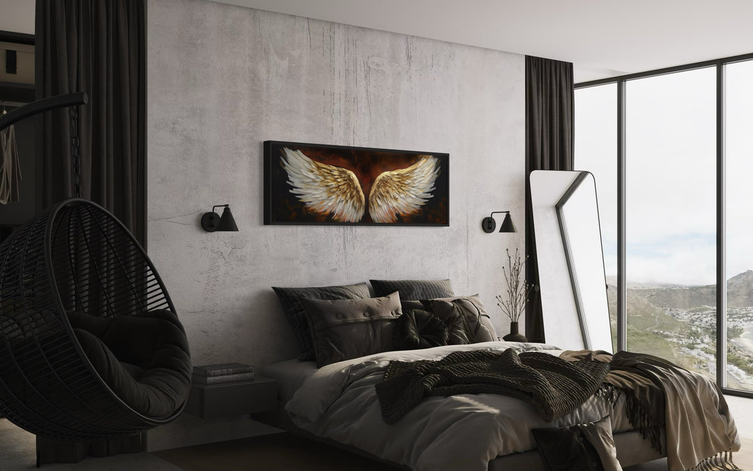 White Gold Angel Wings On Brown Background Horizontal Framed Canvas Wall Art in a bedroom with a large window and a hanging chair