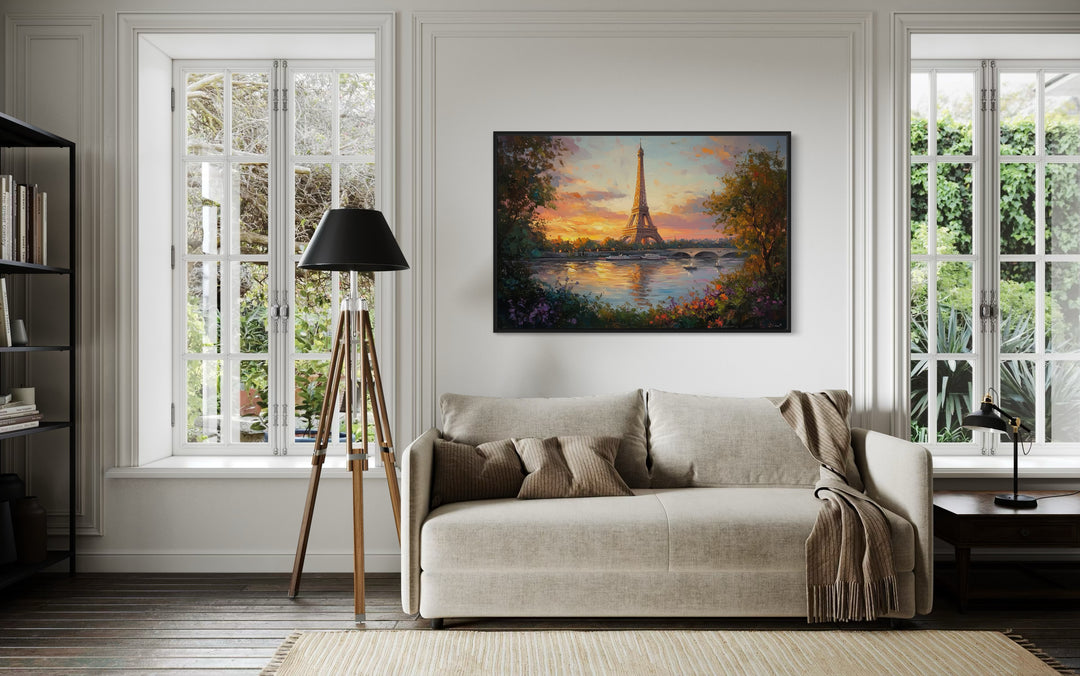 Eiffel Tower Across Seine River Framed Canvas Wall Art in a living room with a couch