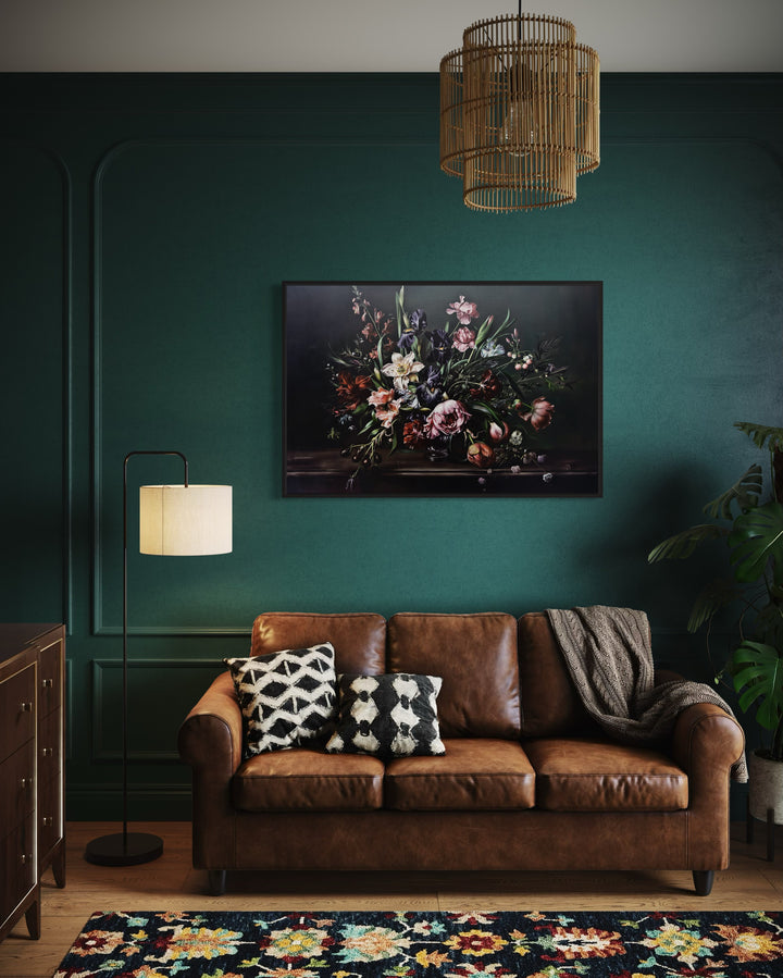 Dark Academia Moody Vintage Flowers Framed Canvas Wall Art in a living room with green walls and a brown leather couch