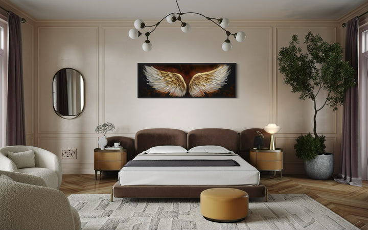 White Gold Angel Wings On Brown Background Horizontal Framed Canvas Wall Art in a bedroom with a large bed