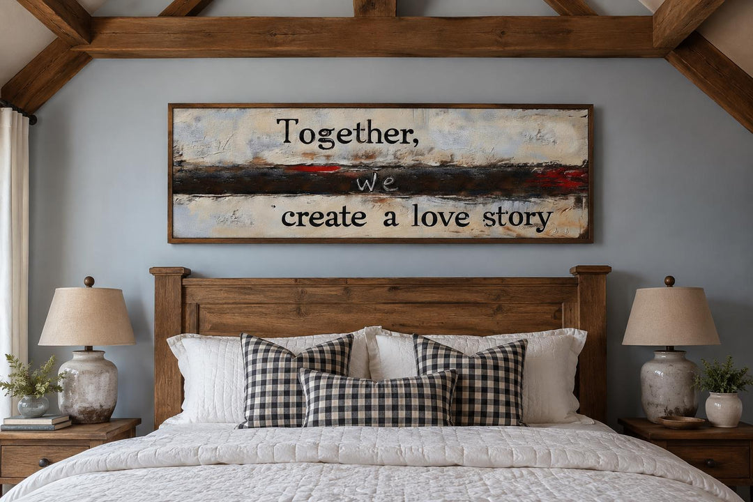 Horizontal canvas wall art with romantic quote above a wooden headboard in a rustic bedroom.