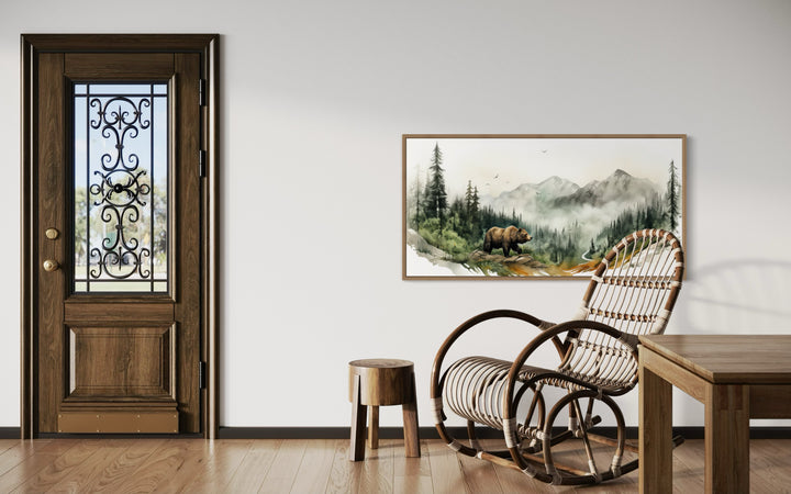 Bear In The Mountain Forest Watercolor Landscape Framed Canvas Wall Art in a room with a rocking chair