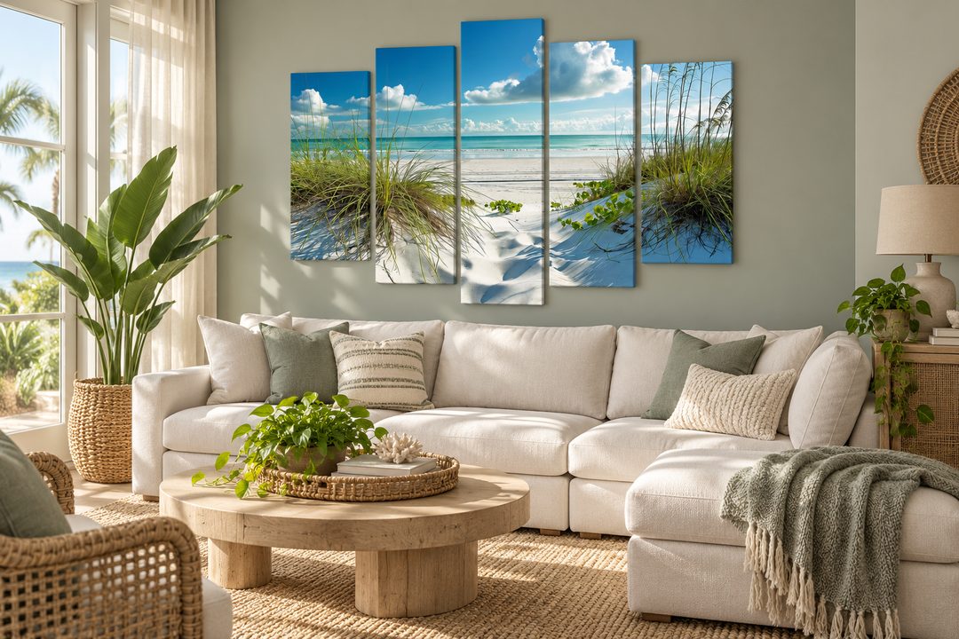 5 piece canvas wall art of a white sand beach and sea grass dunes above a white sectional sofa.