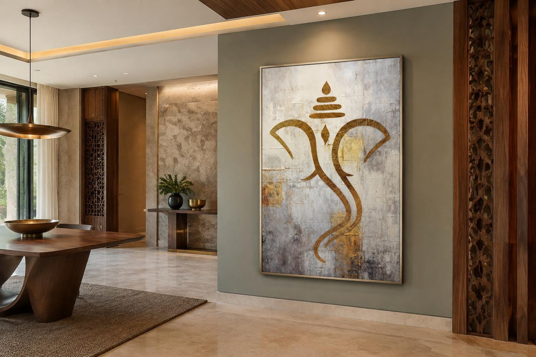 Minimalist gold Ganesha outline on a textured white and silver canvas in a modern dining room.