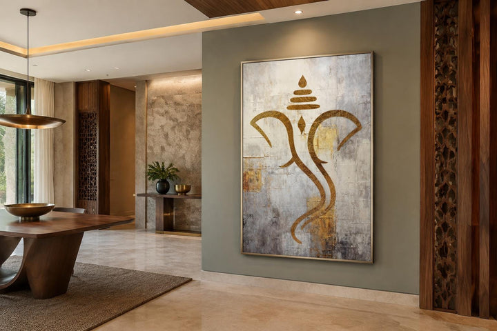 Minimalist gold Ganesha outline on a textured white and silver canvas in a modern dining room.