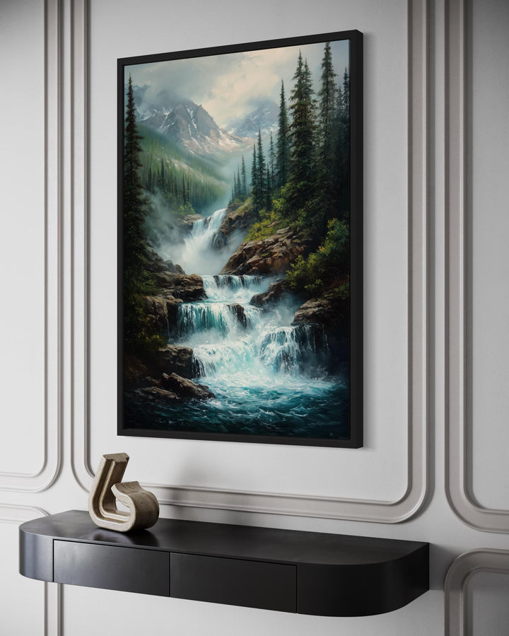 Vertical canvas wall art of a cascading mountain waterfall framed by pines and snow-dusted peaks.