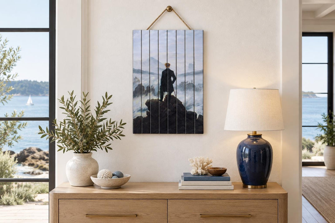 Wanderer Above the Sea of Fog print on distressed wood planks hanging above a wooden console table.
