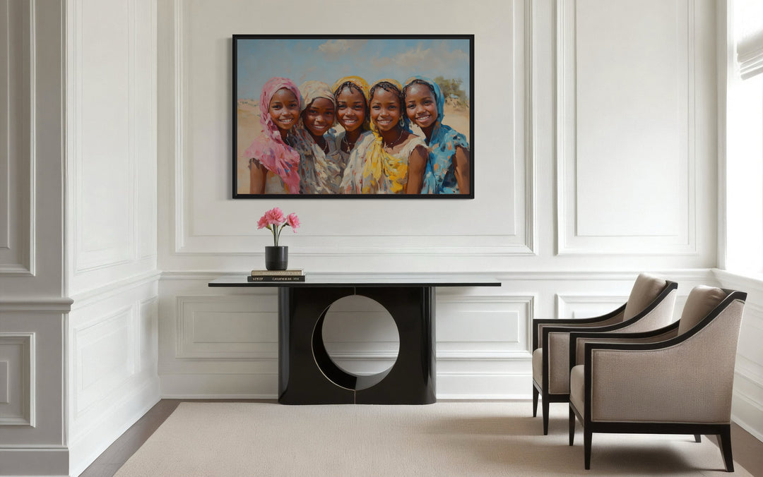 a painting of a group of happy african girls hanging on a wall