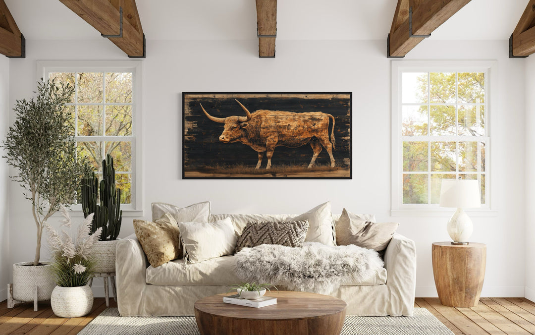 Brown Texas Longhorn Cow Painted On Black Rustic Framed Canvas Wall Art above beige couch