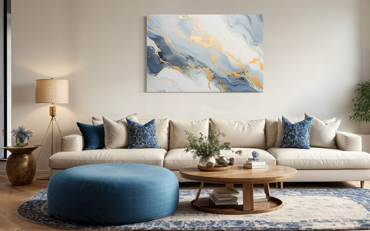 Pale Blue Grey Gold Abstract Marble Canvas Wall Art in a living room with blue accents