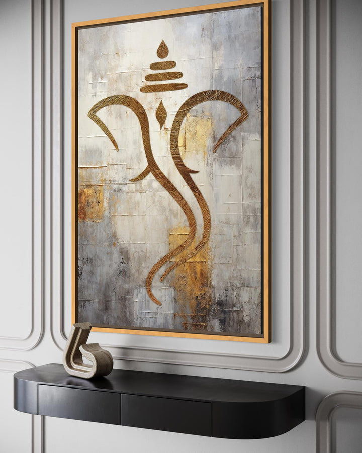 Minimalist gold Lord Ganesha outline on a textured white and silver canvas in a gold frame.