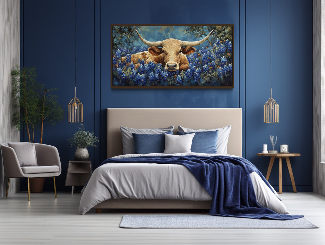 Longhorn in Bluebonnets Rustic Farmhouse Canvas Wall Art above blue bed