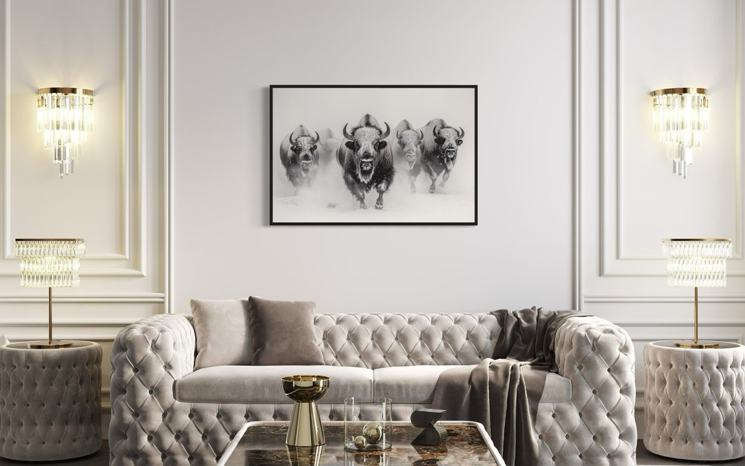 Herd Of Running Bisons In Snow Black White Framed Canvas Wall Art in living room