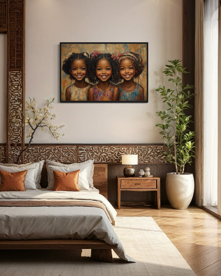 Three Happy Black Girls Smiling Framed Canvas Wall Art in a bedroom with a bed