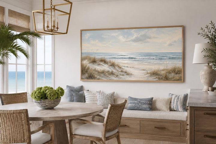 Sandy beach dunes wall art with sea grass and rolling waves in a slim gold frame.