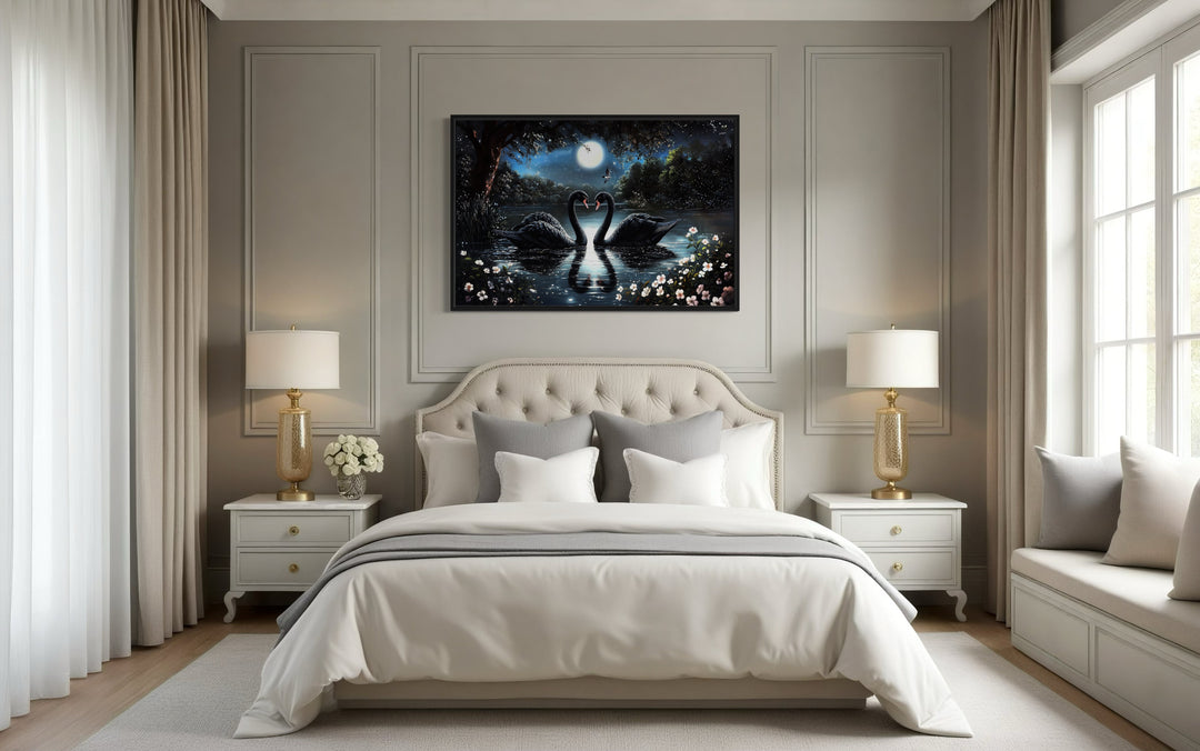 Two Black Swans In The Lake At Night Under Full Moon Romantic Framed Canvas Wall Art in a bedroom with a white bed