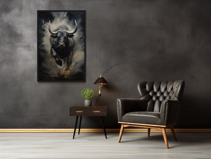 Black Charging Bull Abstract Framed Canvas Wall Art in a living room with a chair and a painting on the wall