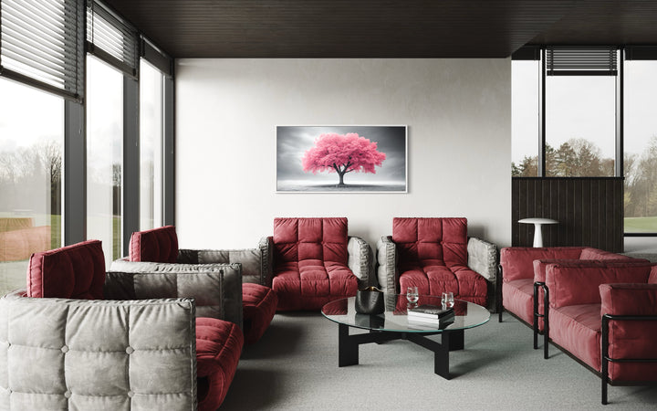 Pink Tree on Black White Background Extra Large Framed Canvas Wall Art in a living room filled with red couches and a glass table