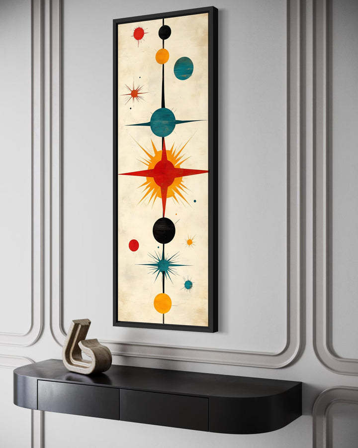 Vertical narrow mid-century modern wall art featuring an abstract atomic starburst design.