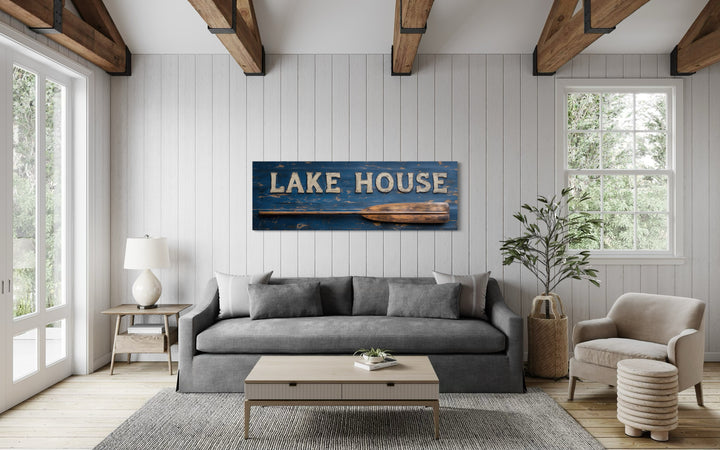 Lake House Sign With Oar Long Horizontal Framed Canvas Wall Art in a living room filled with furniture and a painting on the wall