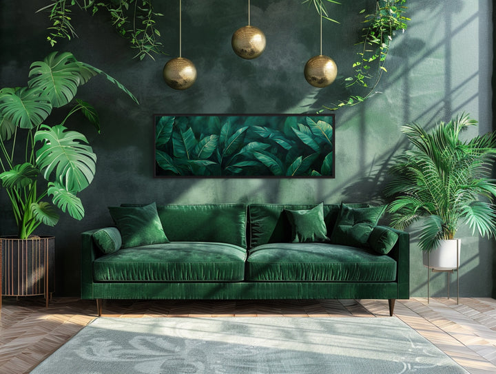 Green Tropical Leaves Long Narrow Horizontal Framed Canvas Wall Art above green couch