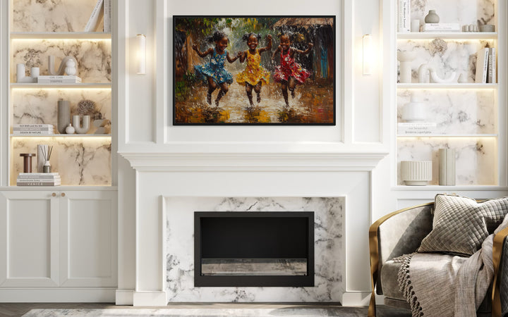 Happy African Girls Dancing In Rain Framed Canvas Wall Art in a living room with a fire place