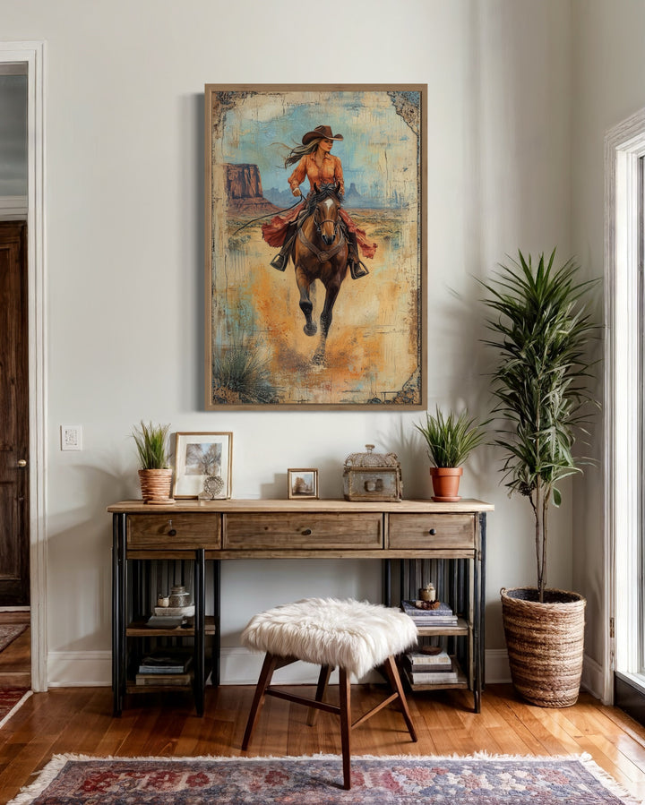 Cowgirl Riding A Horse In Monument Valley Framed Canvas Wall Art above table