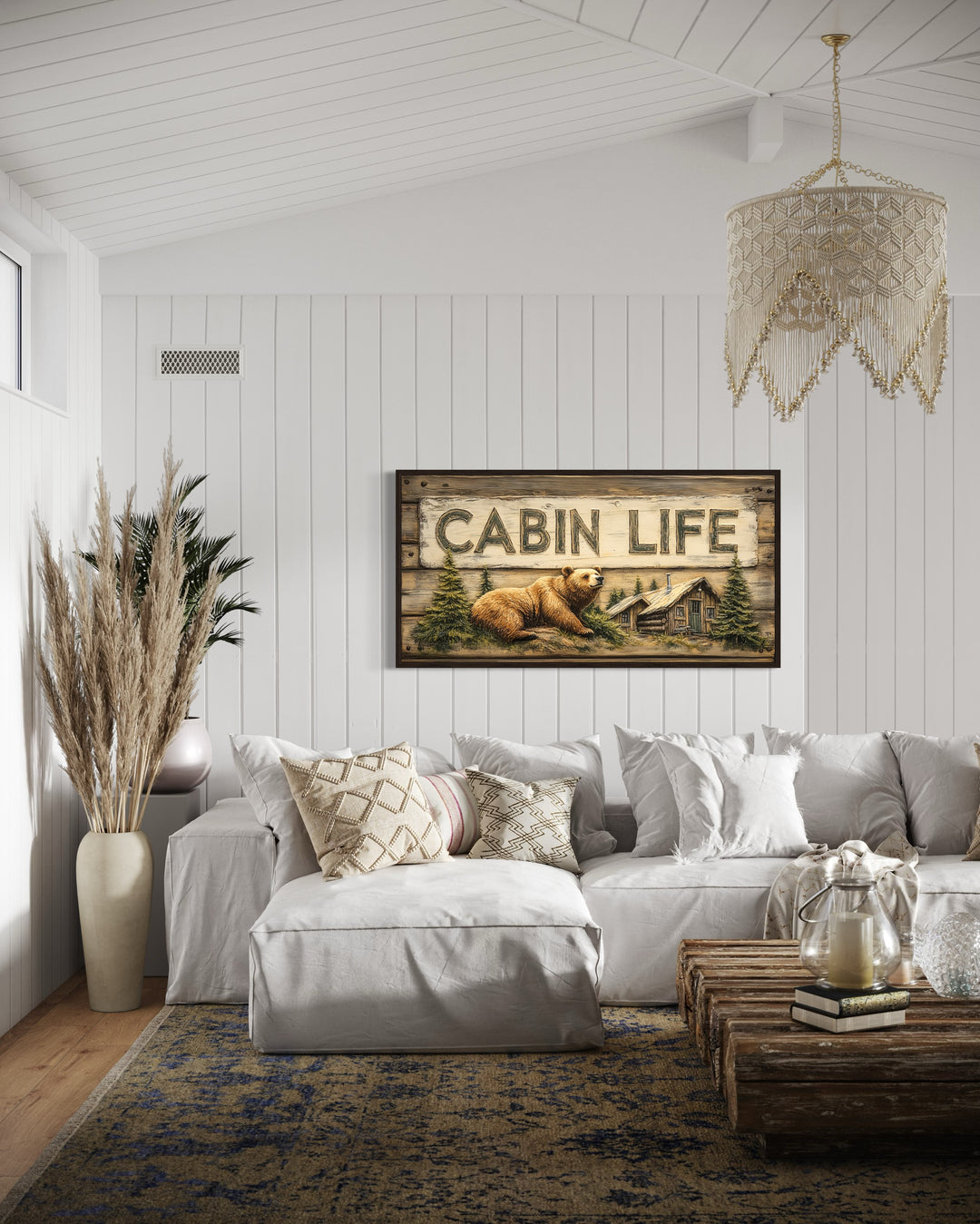 Cabin Life Sign With Log House And Bear Framed Canvas Wall Art in a living room filled with furniture and a painting on the wall