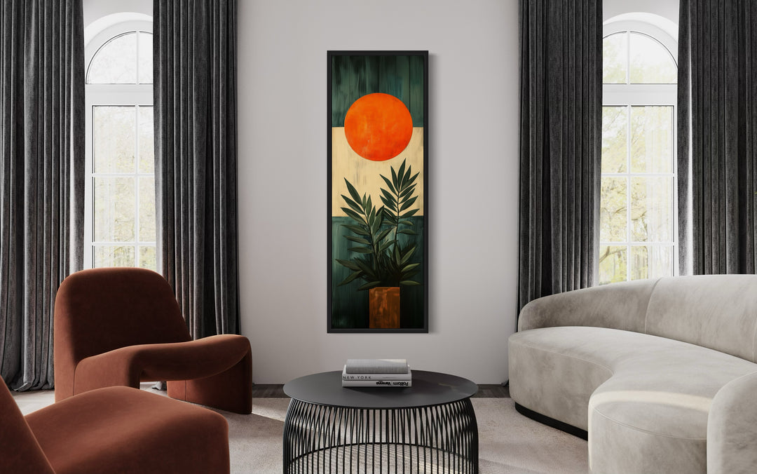 Mid Century Modern Orange Sun And Palm Leaves Framed Canvas Wall Art in a living room filled with furniture