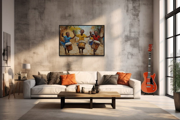 Happy African Kids Playing Drums Framed Canvas Wall Art in a living room filled with furniture