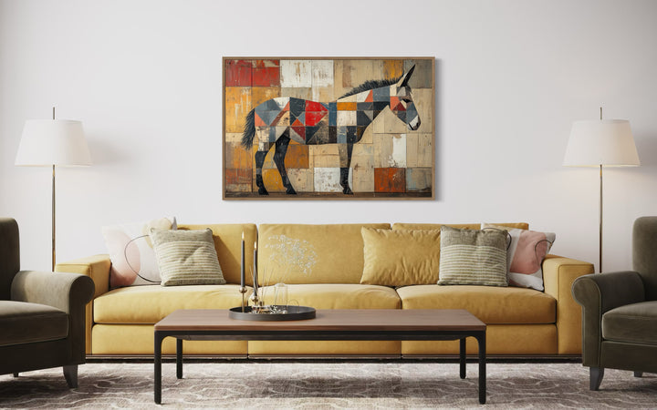 Abstract Primitive Donkey Rustic Southwestern Canvas Wall Art above yellow couch