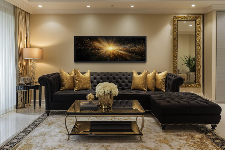 A wide horizontal canvas print of a radiant gold starburst explosion on a black background.