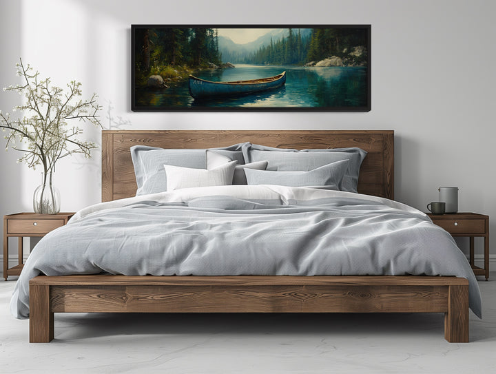 Rustic Blue Canoe In The Lake Framed Canvas Wall Art above wooden bed in cabin