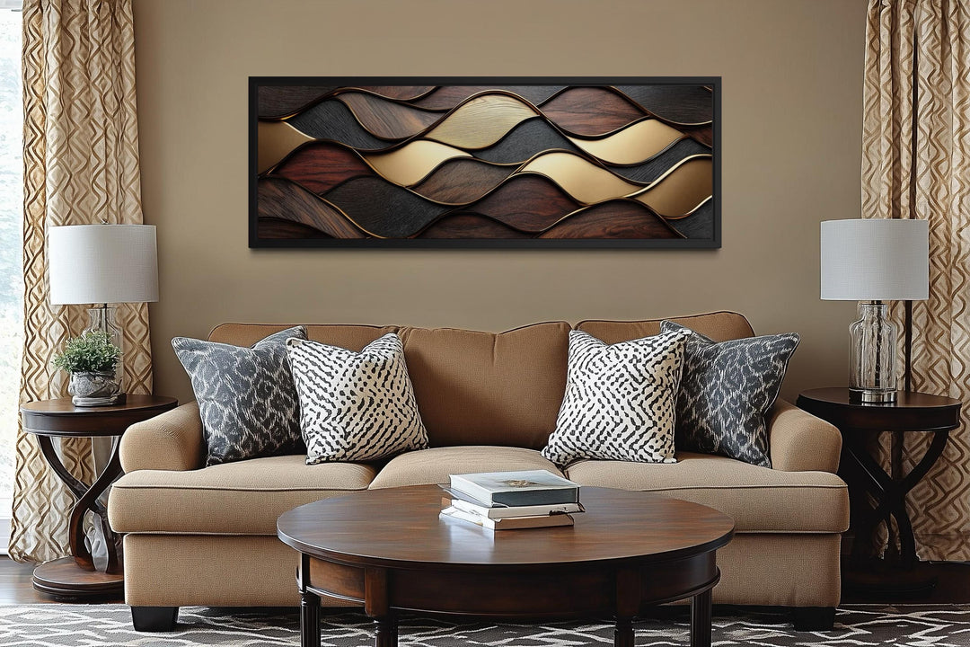 Long horizontal abstract wood texture canvas with brown and gold geometric waves above a sofa.