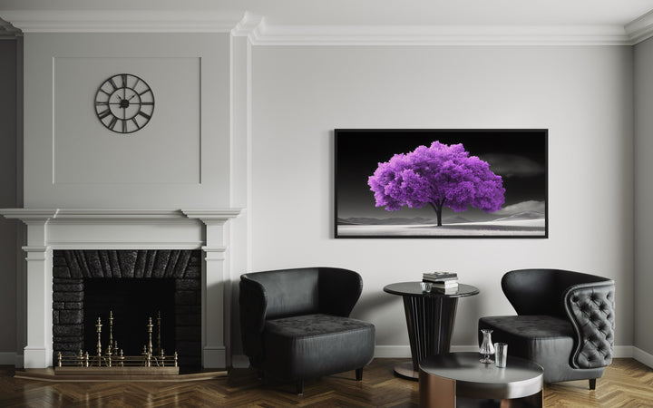 Purple Tree on Black White Background Framed Canvas Wall Art in a living room with two chairs and a fireplace