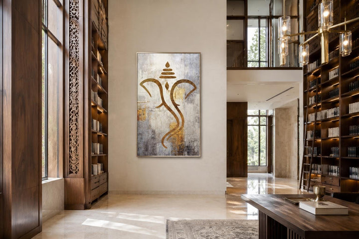 Minimalist gold Lord Ganesha canvas wall art on a textured white and silver background in a library.