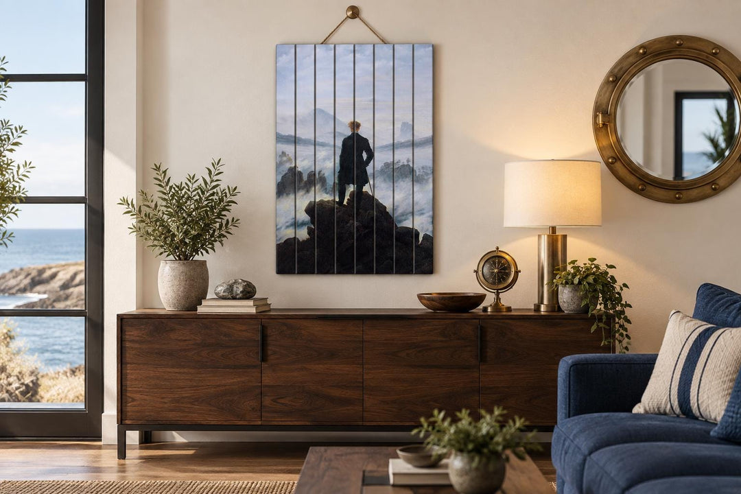 Wanderer Above the Sea of Fog print on vertical distressed wood planks above a wooden sideboard.
